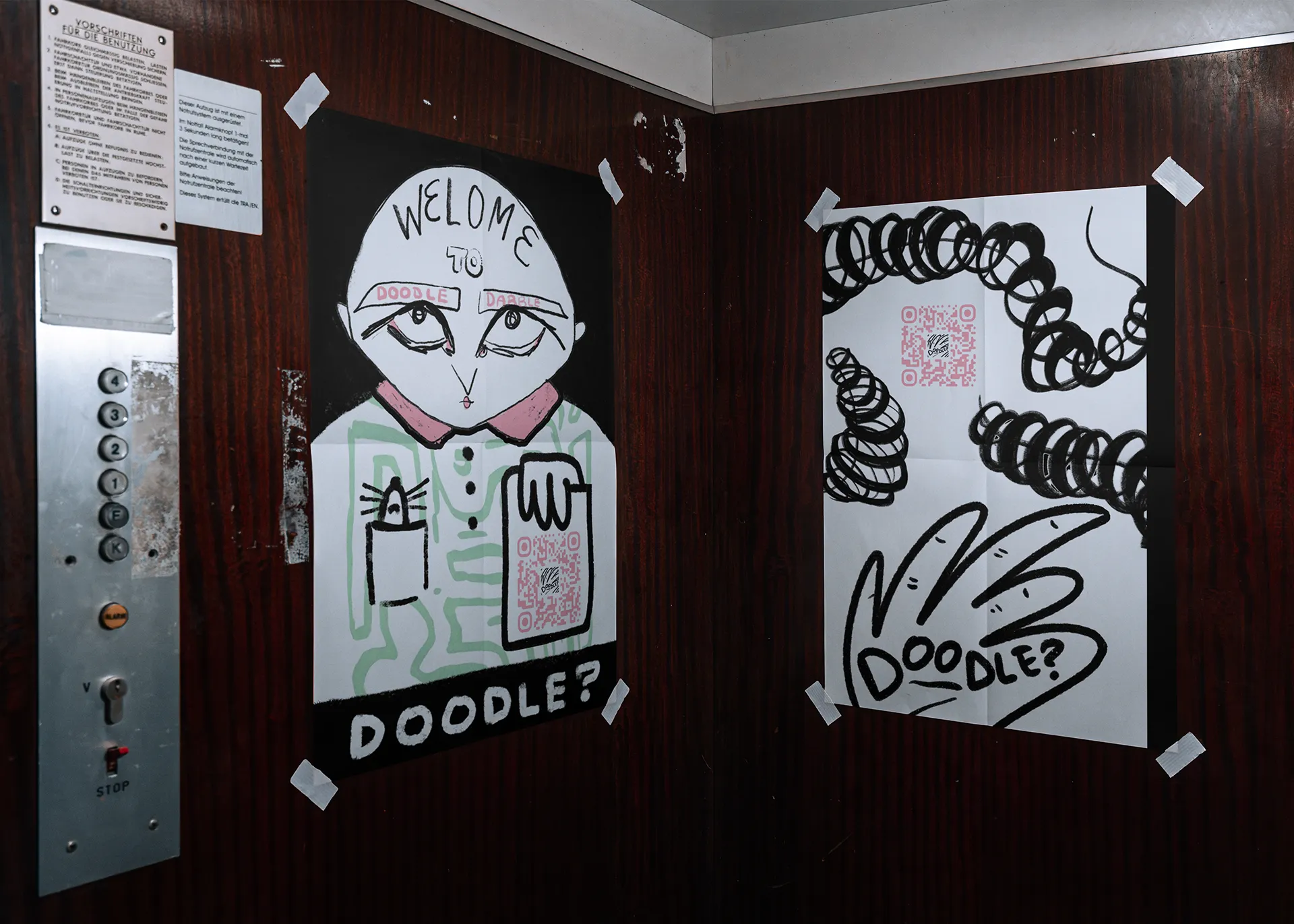 Doodle Dabble posters in elevator